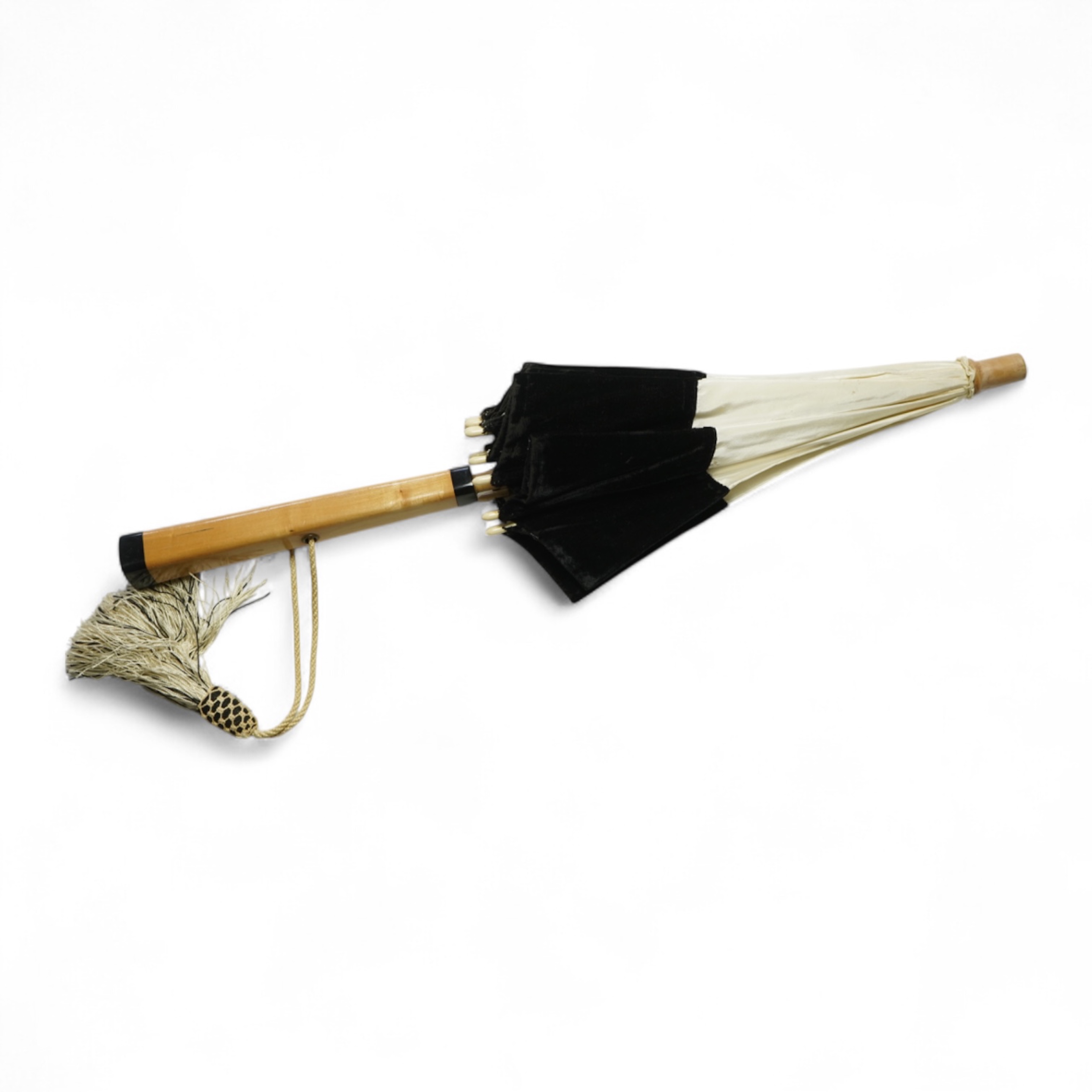 An unusual early 20th century cream silk and black velvet parasol and silk corded tassel. 64cm high. Condition - good